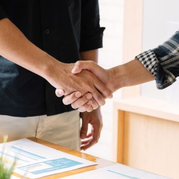 business people handshake for teamwork of business merger and acquisition.