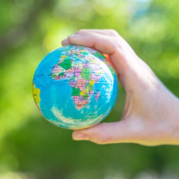 Human hands holding global earth ball. Sustain earth concept. Love nature. Save the planet. . High quality photo