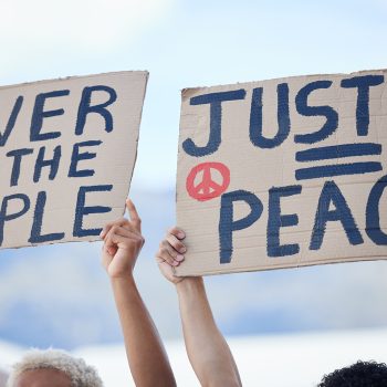 Protest, crowd and activism for peace, climate change and justice in street with poster in hands. P.